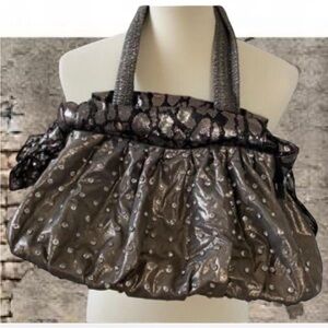 Silver metallic studded slouchy hobo handbag with snake trim